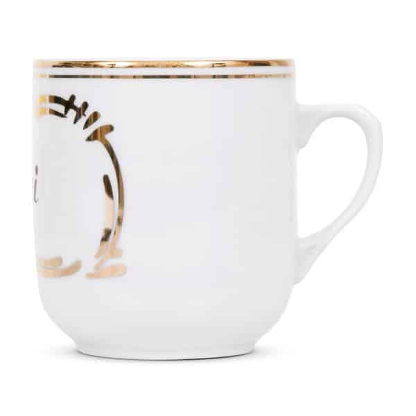 Side view of coffee cup made of fine porcelain decorated with noble gold ornaments